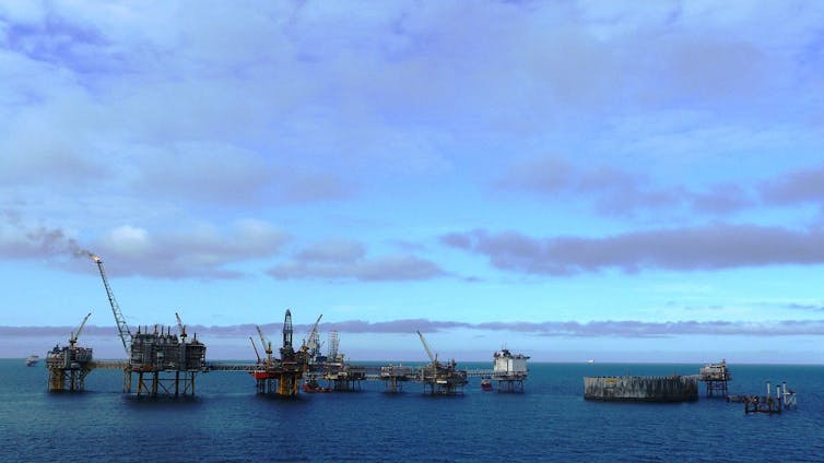 Several structures standing in the sea.