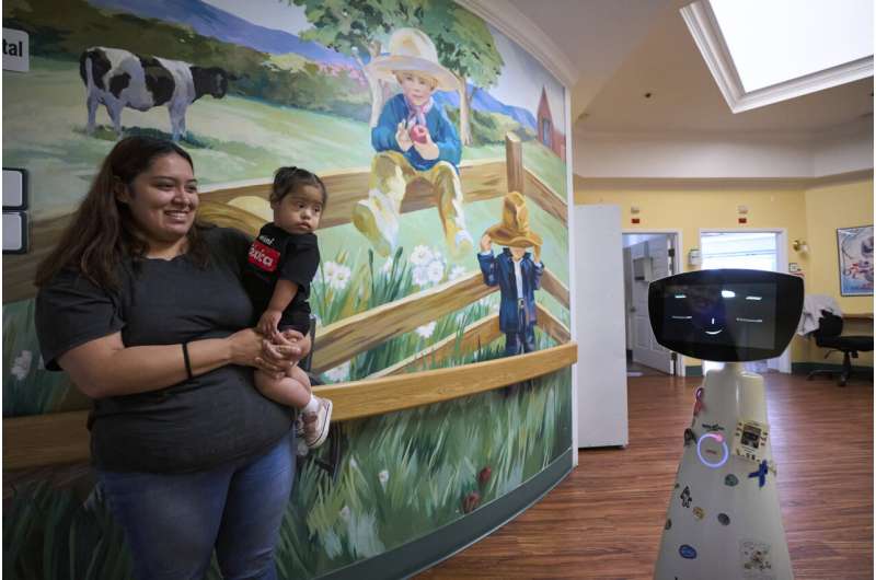 A robot programmed to act like a 7-year-old girl works to combat fear and loneliness in hospitals