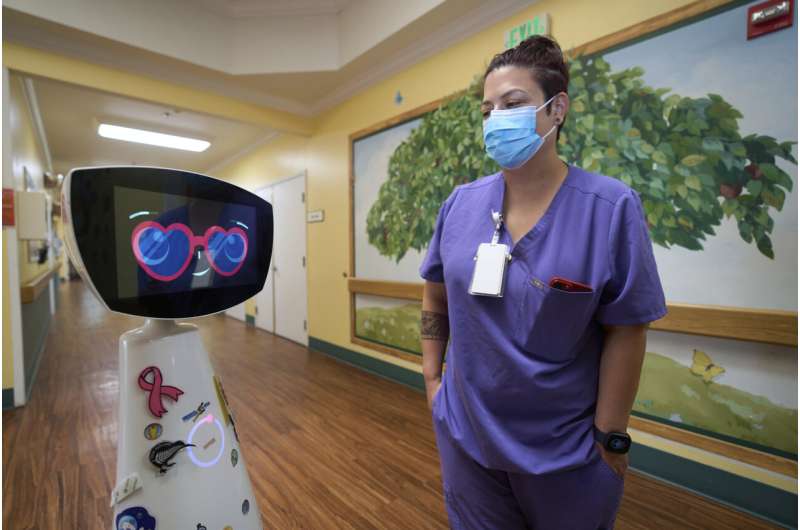 A robot programmed to act like a 7-year-old girl works to combat fear and loneliness in hospitals