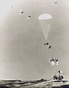 A poster showing the Viking craft parachuting to the Martian surface.