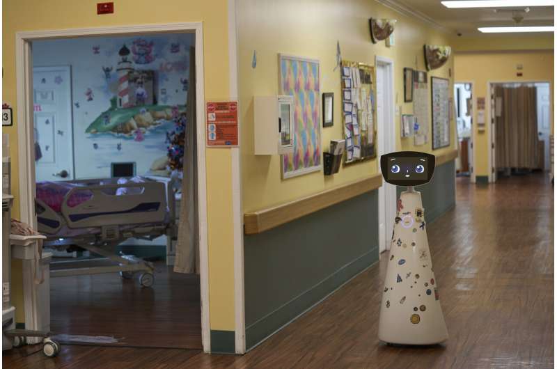 A robot programmed to act like a 7-year-old girl works to combat fear and loneliness in hospitals