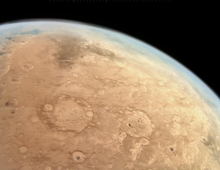 A view of Mars' crater-flecked surface from above.